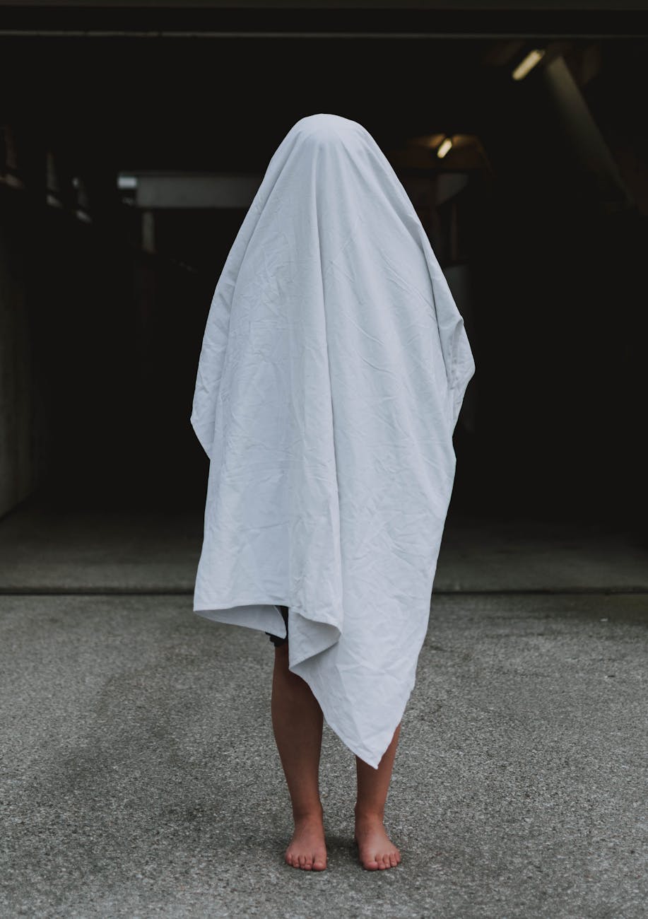 person covered with white cloth