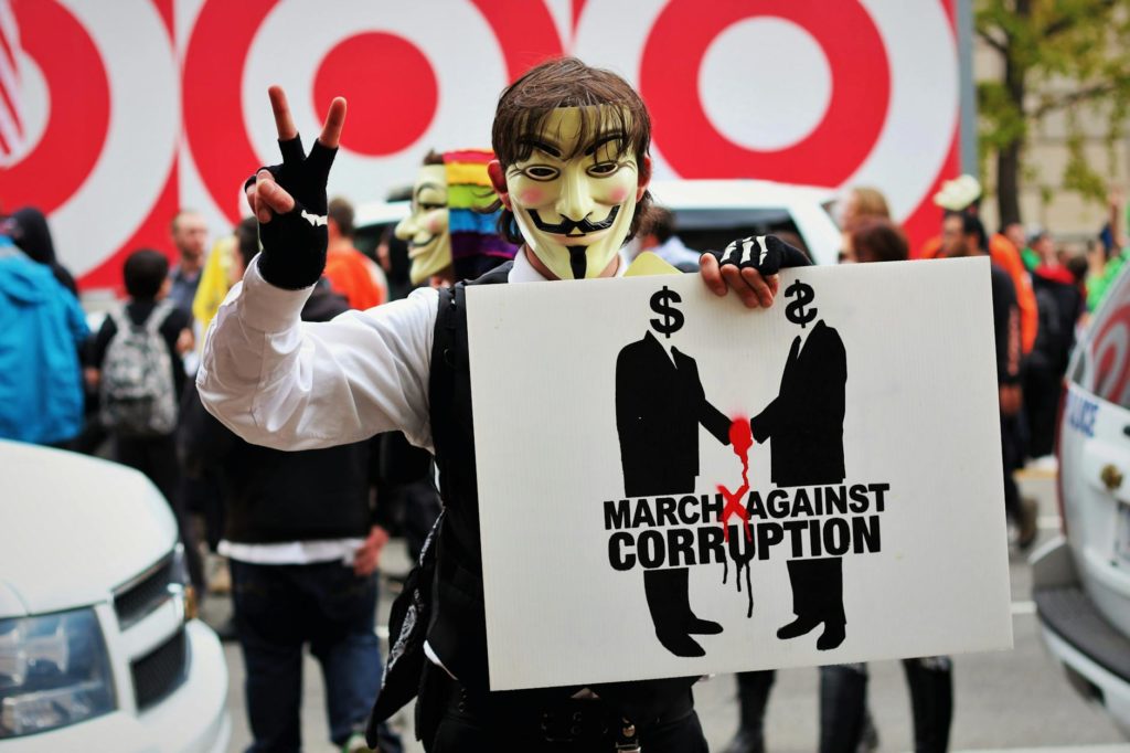 photo of person wearing guy fawkes mask